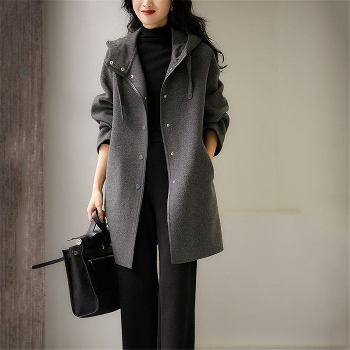 Women's mid-length wool blend coat with hood and snap button placket in oversized fit Mune Fashion