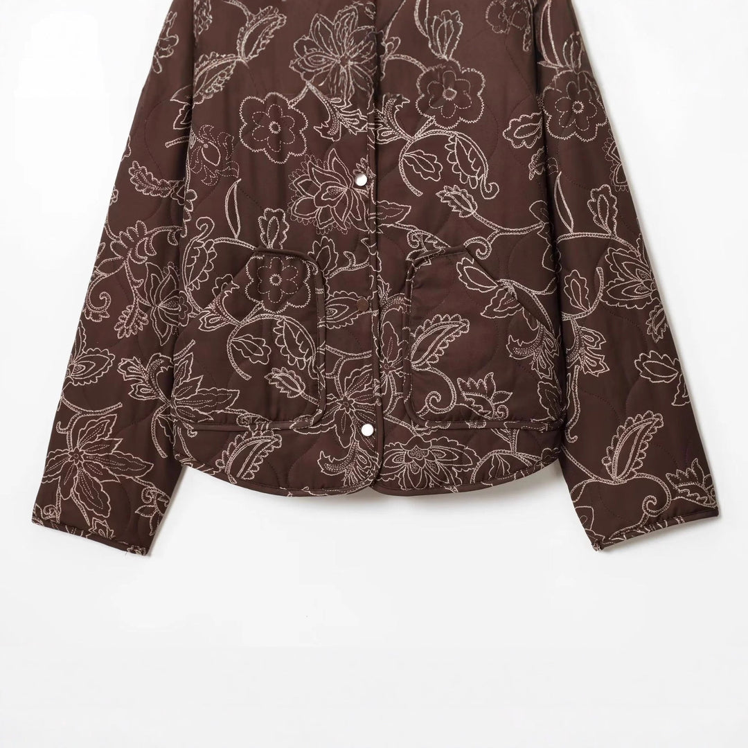 Women's padded short jacket with floral quilting pattern, snap button front and waist drawstring Mune Fashion