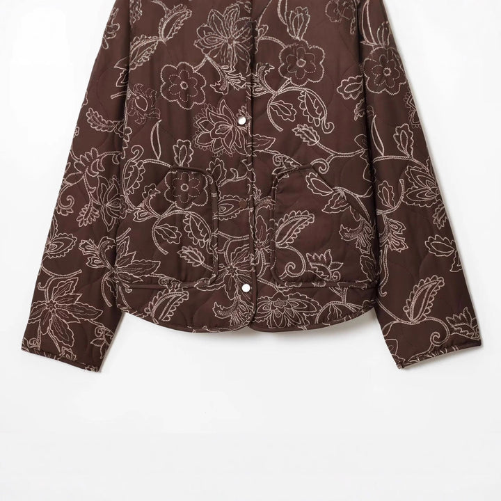 Women's padded short jacket with floral quilting pattern, snap button front and waist drawstring Mune Fashion