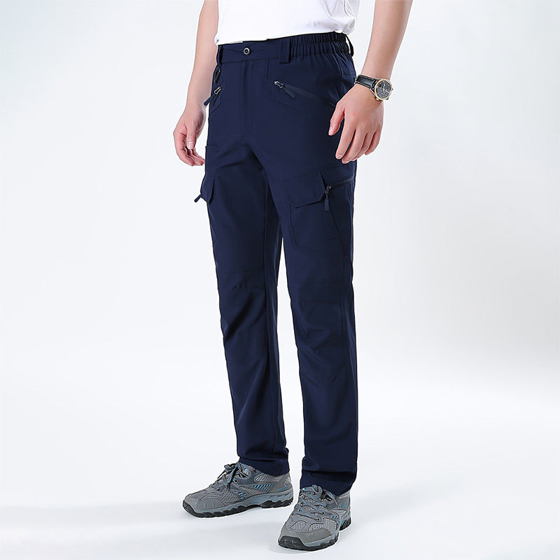 Men's nano technical trekking pants with elastic waistband, pre-shaped knees, and multiple cargo and zip pockets.