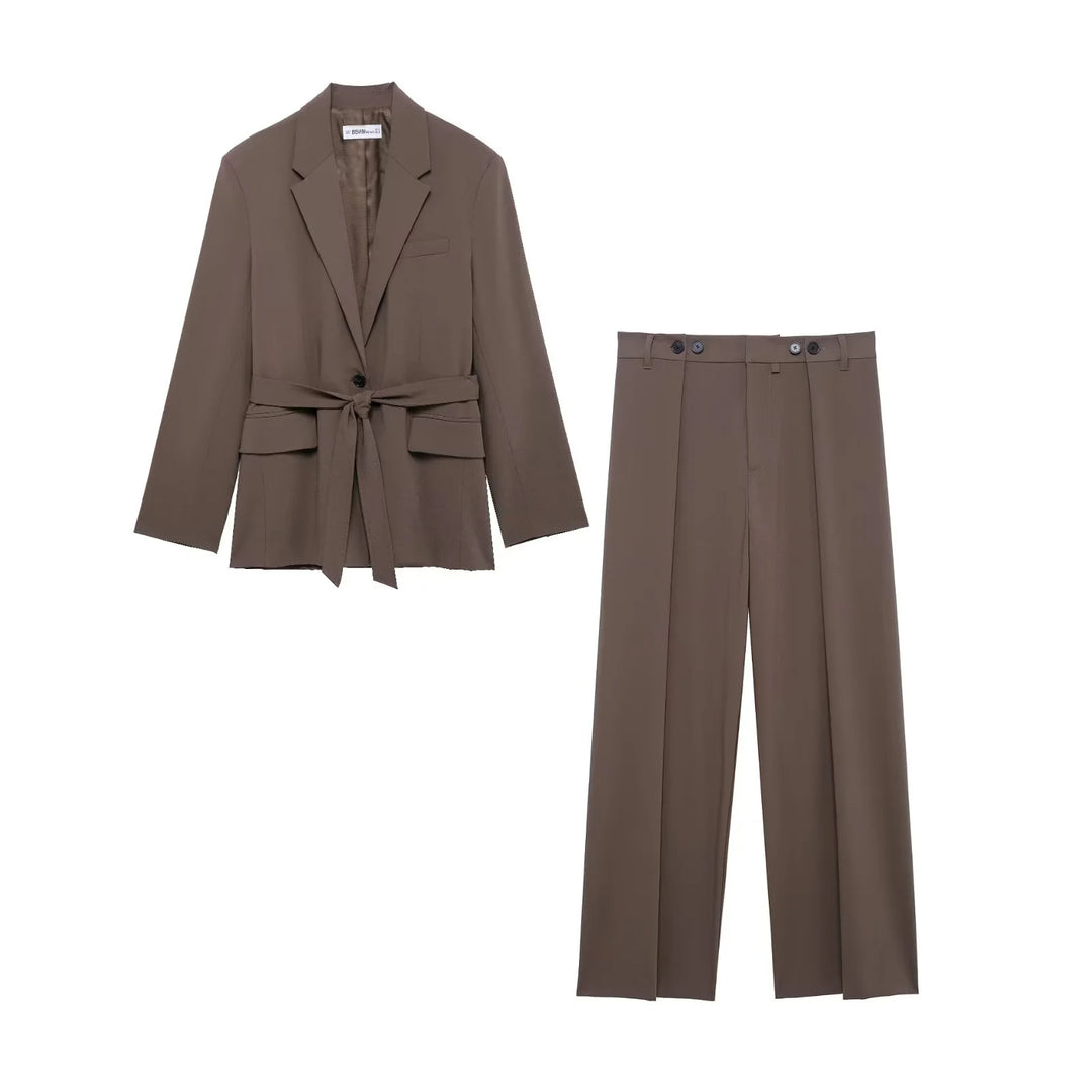 Women's tailored blazer with tie belt, lapel collar, flap pockets, and one-button closure Mune Fashion