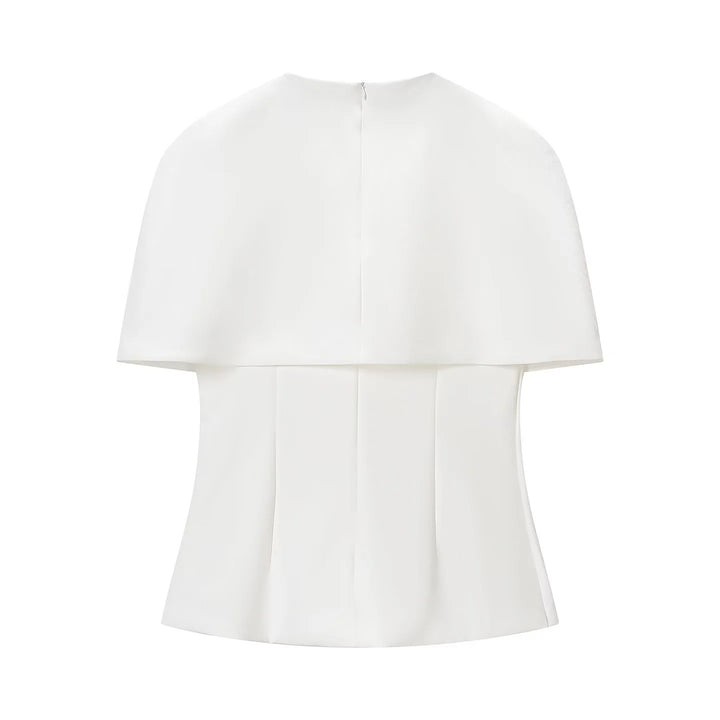 Women's sleeveless cape top with tailored peplum and textured crepe quality Mune Fashion