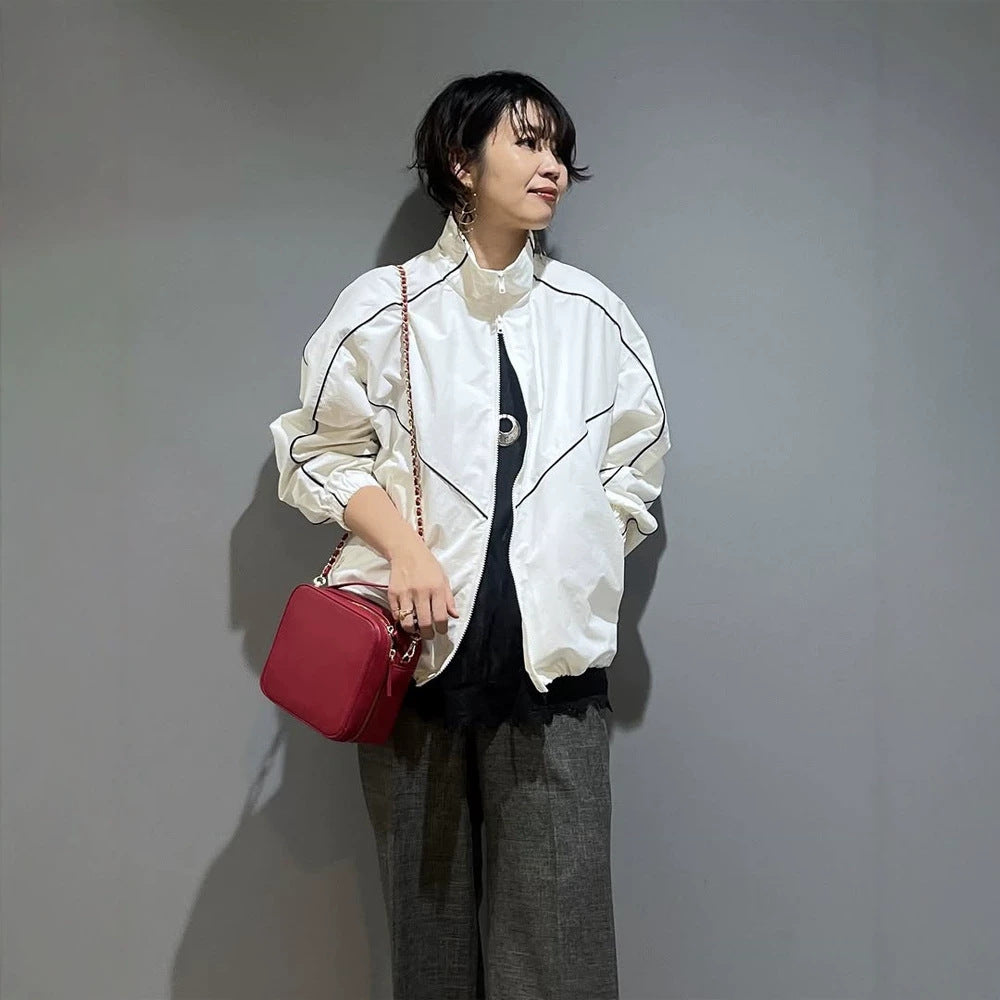 Women’s short bomber-style jacket with sculptural seam design and high stand-up collar Mune Fashion