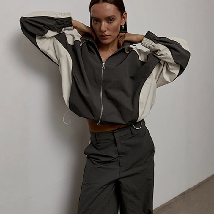 Women's oversized sporty track jacket with high stand-up collar and raglan sleeves Mune Fashion