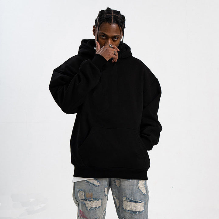 Unisex minimalist oversized hoodie with double hood, dropped shoulder, and wide ribbed hem Mune Fashion