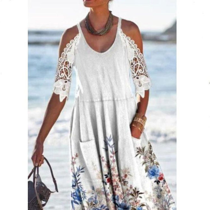 Women’s flowing maxi dress with shoulder cutouts crochet lace sleeves A-line cut and side pockets Mune Fashion