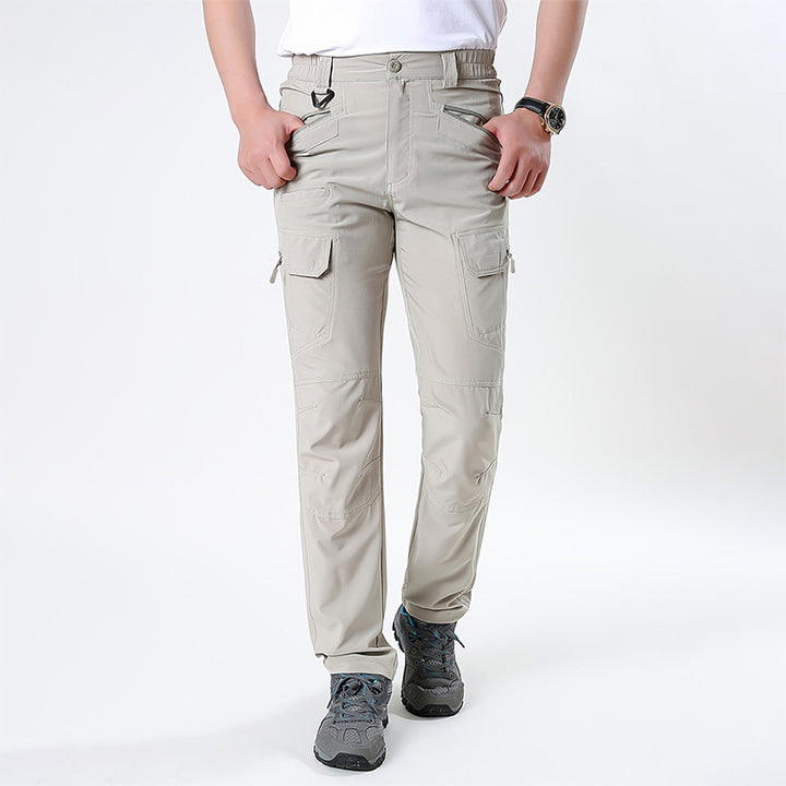 Men's nano technical trekking pants with elastic waistband, pre-shaped knees, and multiple cargo and zip pockets.