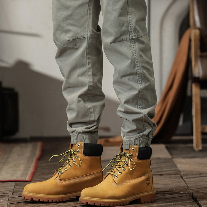 Men's tapered cargo pants in jogger style with knee seam details, drawstring & elastic cuffs
