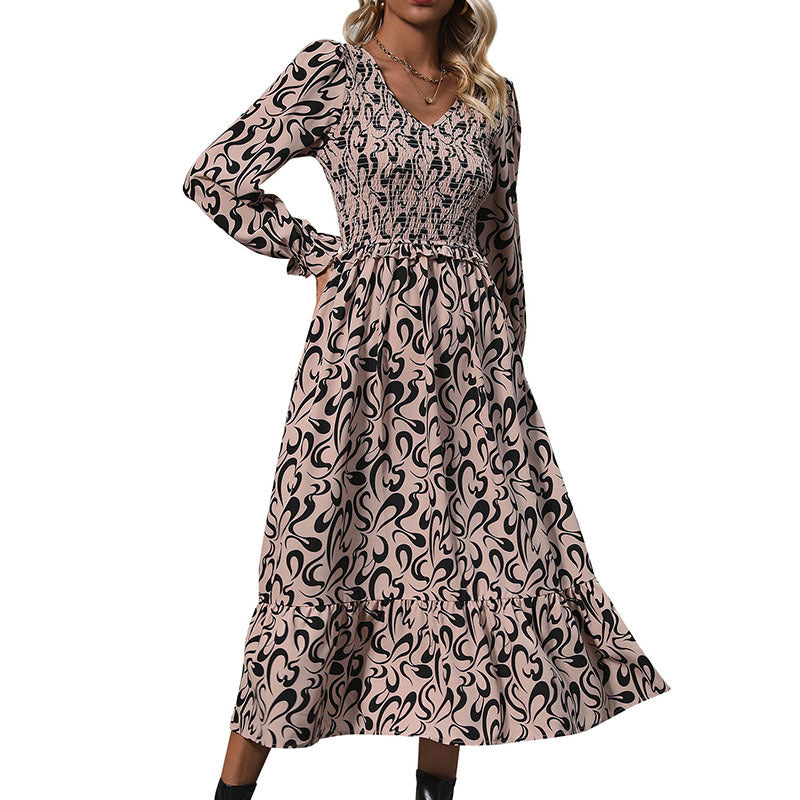 Women’s midi dress with elastic smock top, abstract all-over print and flared ruffle hem Mune Fashion