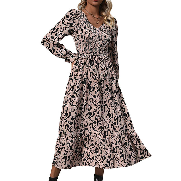 Women’s midi dress with elastic smock top, abstract all-over print and flared ruffle hem Mune Fashion