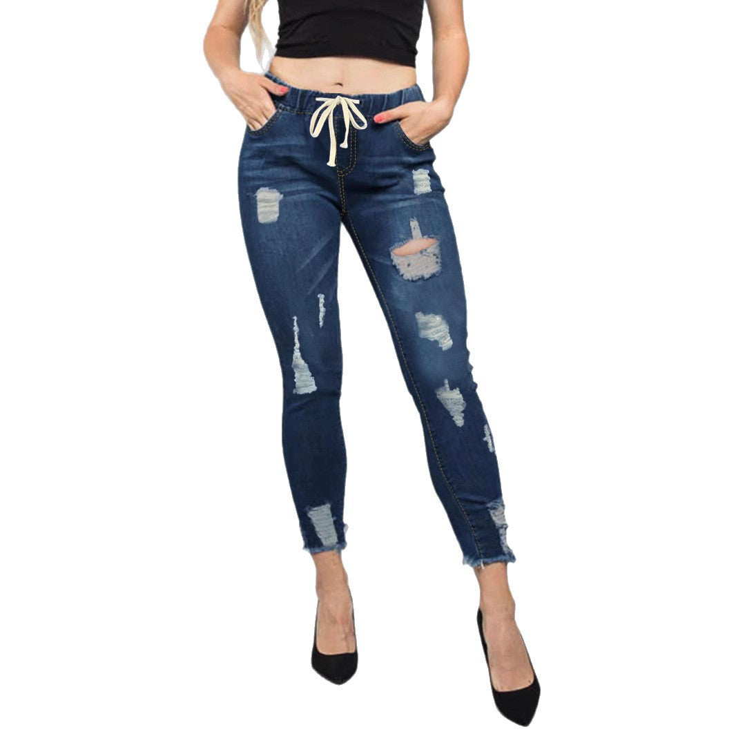 Women High-Waisted Destroyed Jogger Jeans with Elastic Drawstring Waistband and Cropped Frayed Hem Mune Fashion