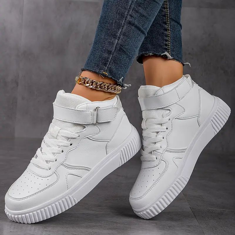 Women’s ankle-high polyurethane leather casual shoe with Velcro cuff, perforated toe cap, and textured rubber sole Mune Fashion