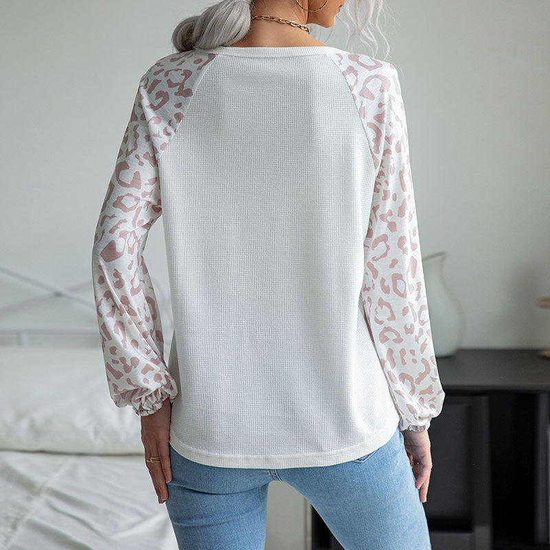 Ladies V-neck waffle knit top with transparent net sleeves in leopard print Mune Fashion