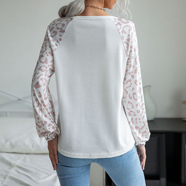 Ladies V-neck waffle knit top with transparent net sleeves in leopard print Mune Fashion