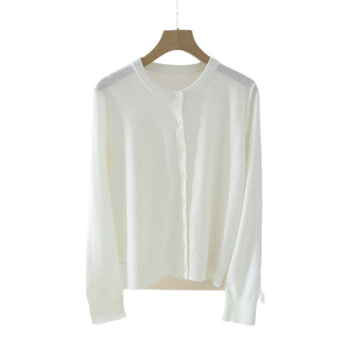 Women's fine round neck cardigan made of lightweight fine knit with pearl button placket and subtle glitter effect.