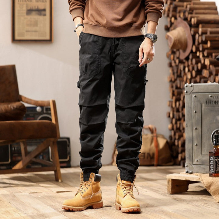 Men's outdoor work jogger pants with elastic comfort waistband, patch round pockets, and ankle zipper Mune Fashion