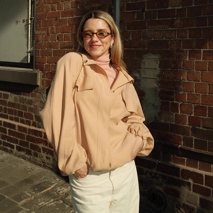 Women's cropped blouson jacket with dropped balloon sleeves, flap pockets, and concealed front placket Mune Fashion