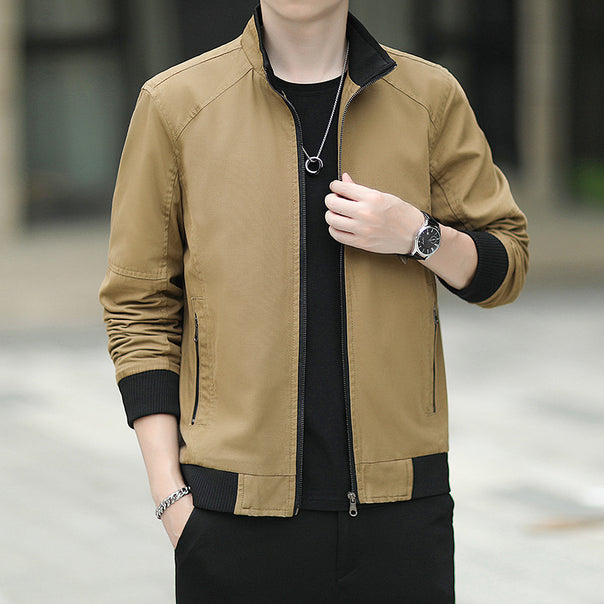 Men's slim-fitting micro canvas bomber with high stand collar, concealed zipper, and elastic ribbed cuffs.