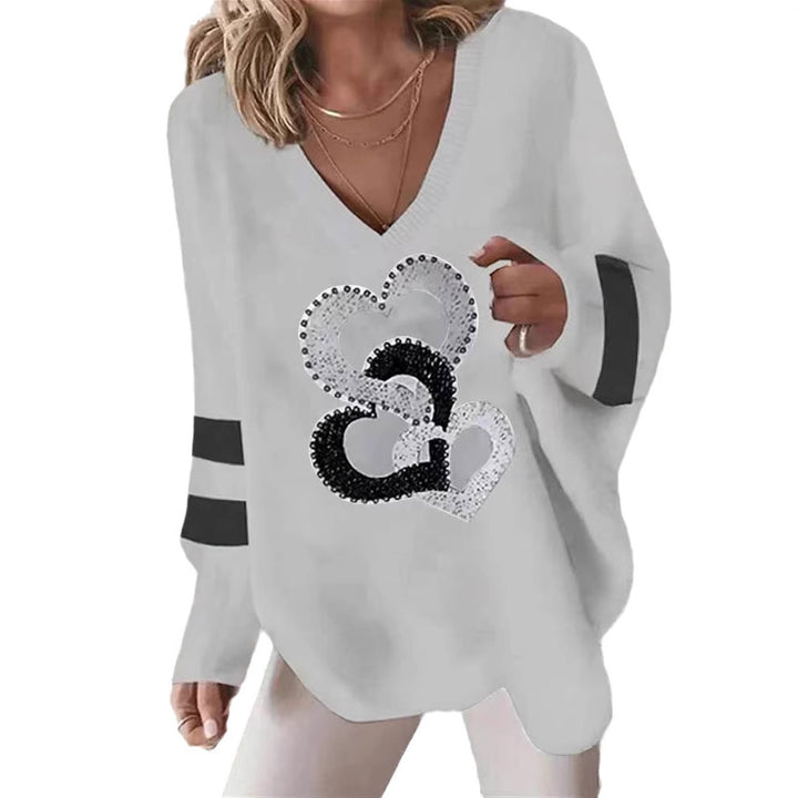 Women's oversized knitted sweater with deep neckline sequin heart and contrast sleeve stripes Mune Fashion