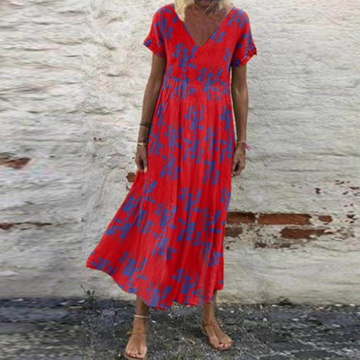 Women’s V-neck maxi dress with fine pleated skirt, empire bodice and short sleeves Mune Fashion