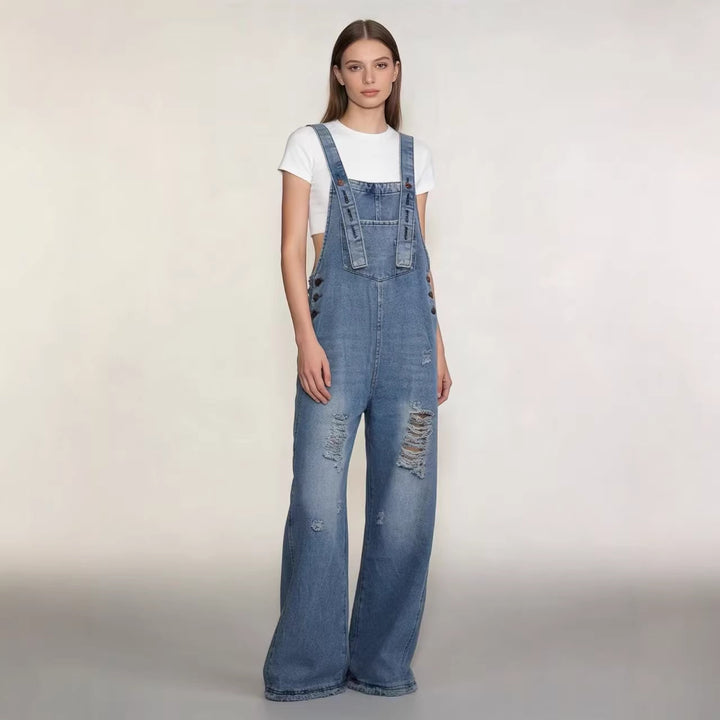 Women's modern baggy overalls made of pigment-dyed stretch denim with adjustable straps and visible rips Mune Fashion