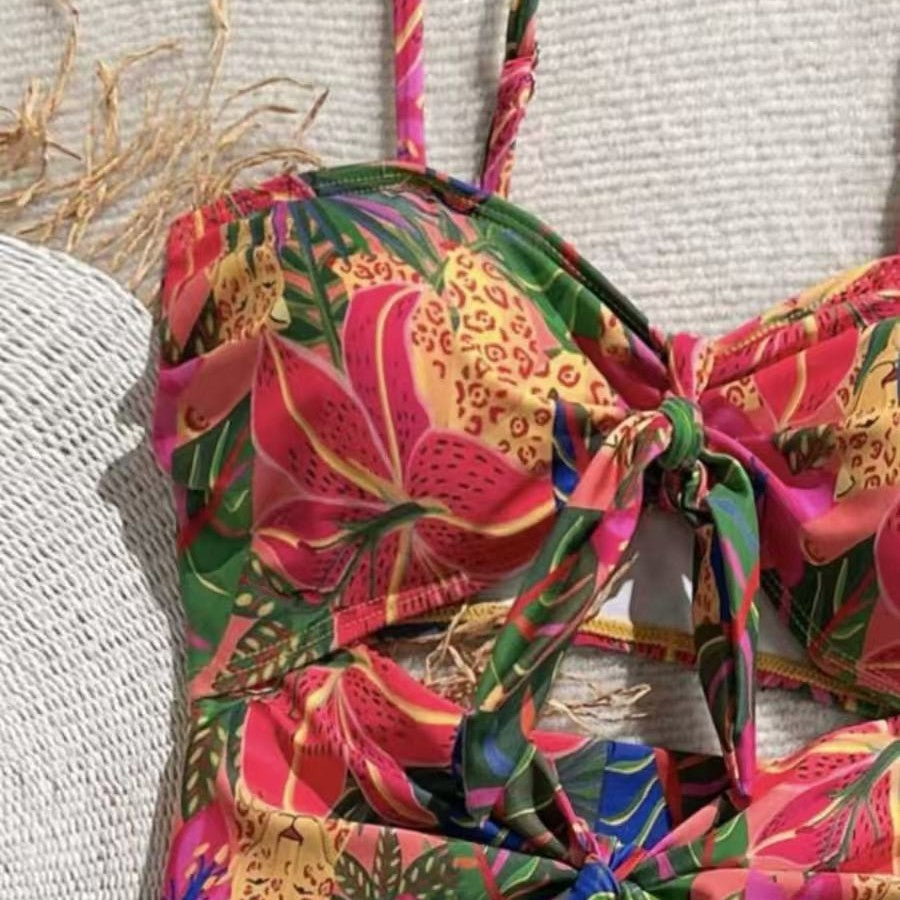 Women's one-piece swimsuit with decorative knot detail and playful floral design Mune Fashion