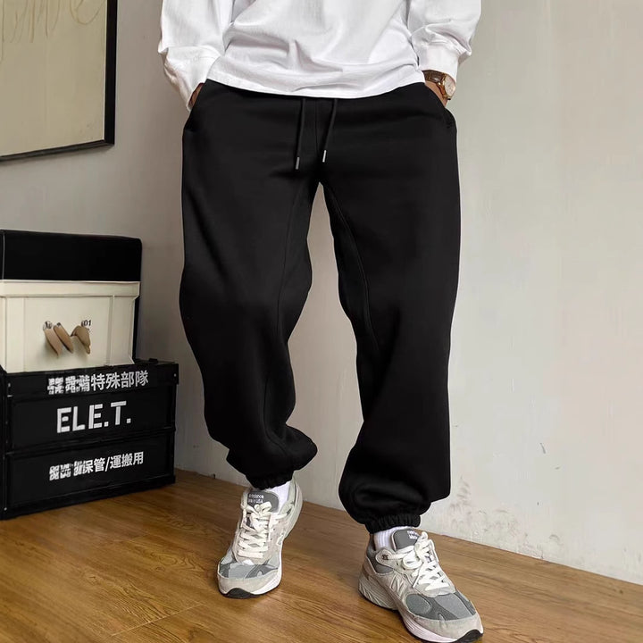 Men's nan tapered jogging pants with distinctive seam, drawstring, and elastic ankle cuffs Mune Fashion