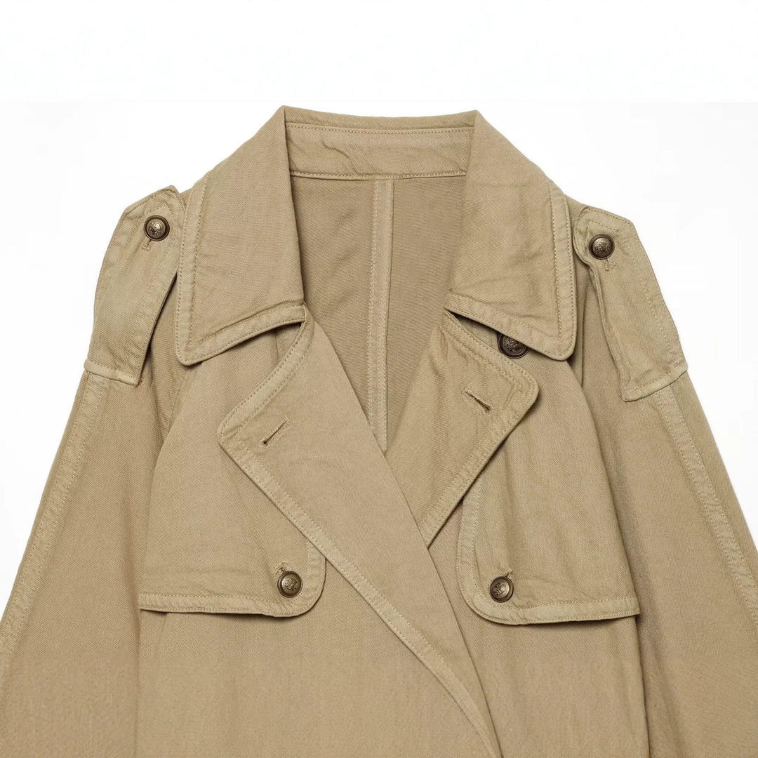 Women's short trench coat with double-breasted button placket, shoulder epaulets, and waist belt Drune