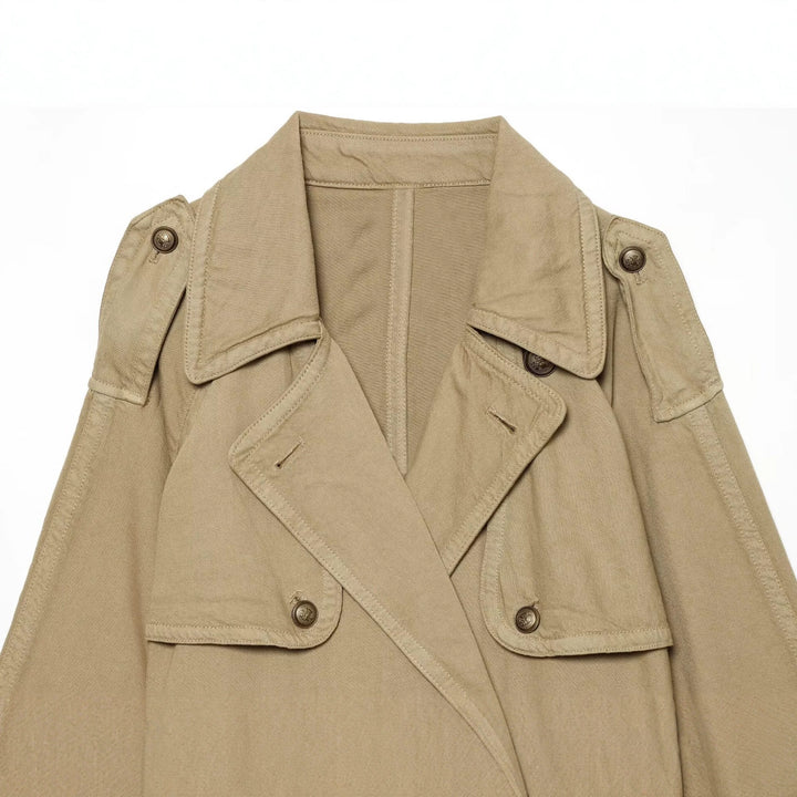 Women's short trench coat with double-breasted button placket, shoulder epaulets, and waist belt Drune