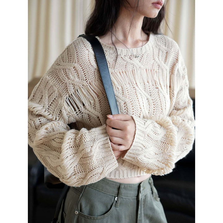 Women’s short oversized knitted sweater with openwork pattern and fringes