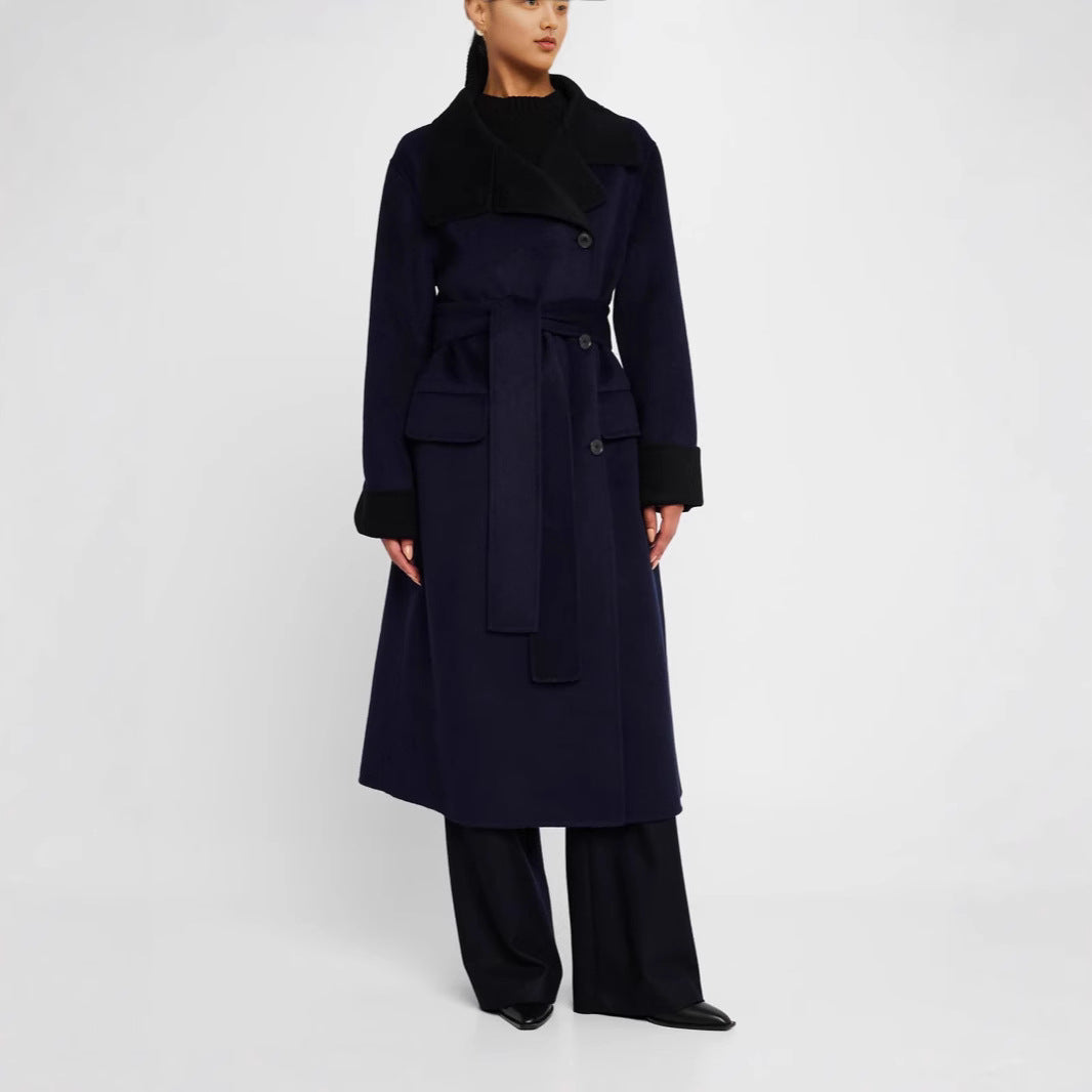 Women's tailored wool blend coat with tie belt, contrast lapel and flap pockets Mune Fashion