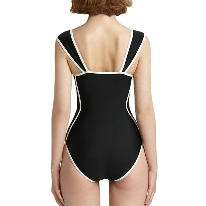 Women's stylish one-piece swimsuit with deep V-neckline and contrasting details Mune Fashion