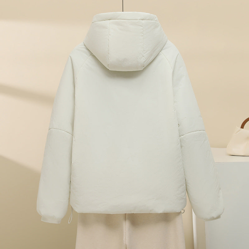 Women's quilted hooded jacket with short boxy cut, adjustable hem, and warming padding Mune Fashion