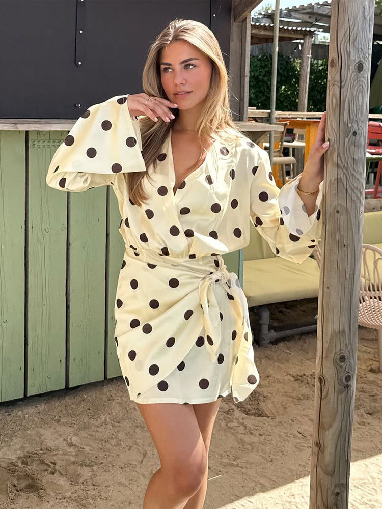 Ladies wrap mini dress with V-neck, bell sleeves and polka dot print Mune Fashion