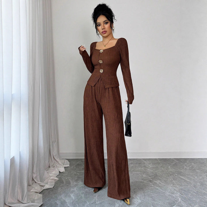 Women's tailored blouse and pants set made of crinkle pleats with puff sleeves and decorative buttons Mune Fashion