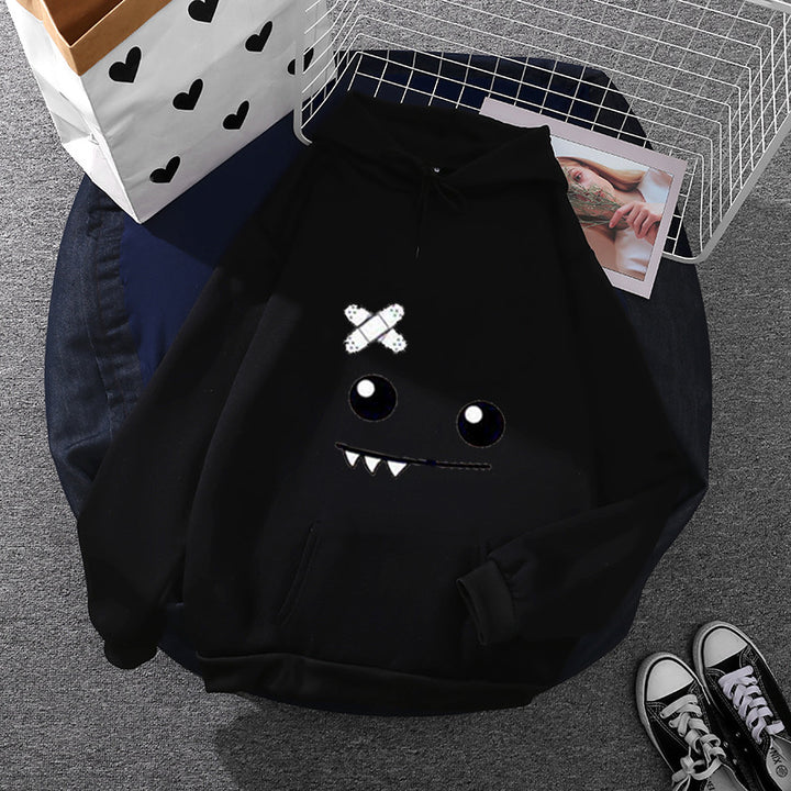 Women's hoodie with playful monster face, bandage application and kangaroo pocket Mune Fashion