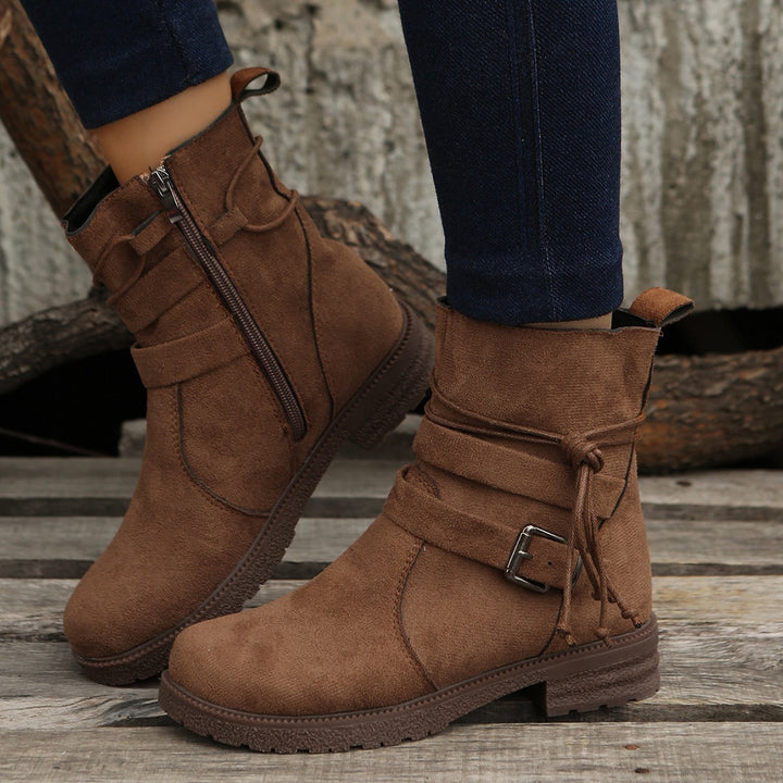 Women's ankle boots made of suede effect with a side zipper, decorative wrap strap, and sturdy profiled sole Mune Fashion
