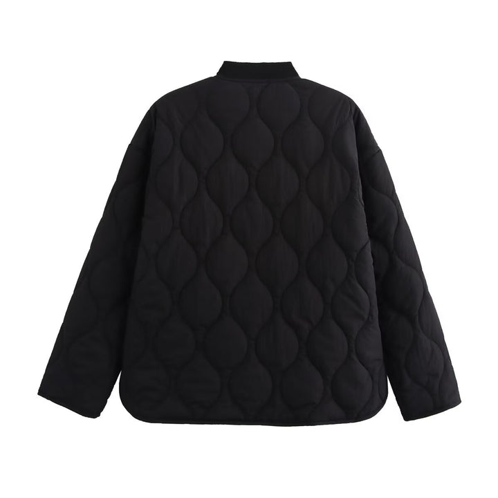 Women's quilted jacket with round neck, flap pockets, and reversible lining Mune Fashion