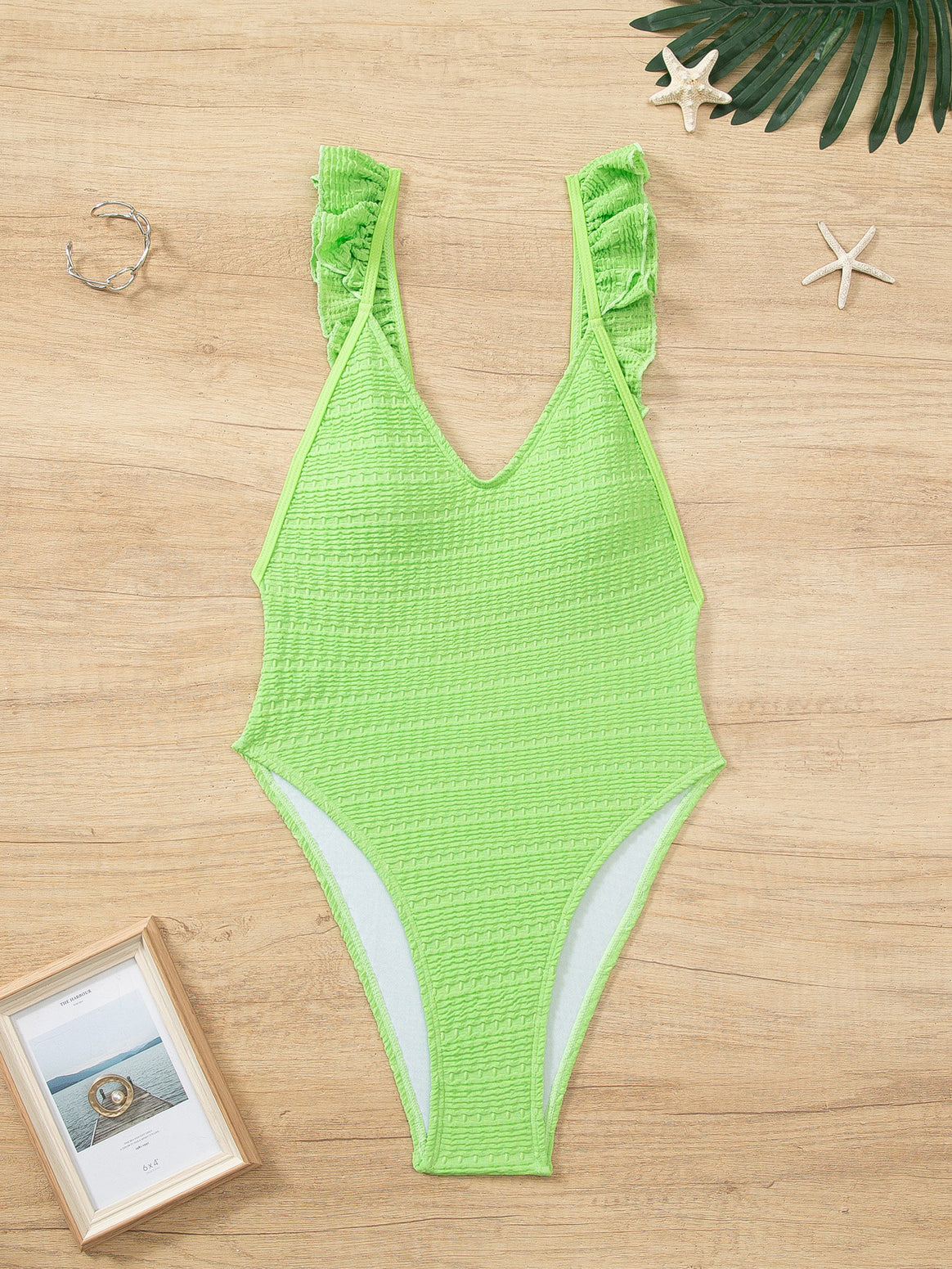 Ladies' one-piece swimsuit with ruffle details and high leg cut Mune Fashion