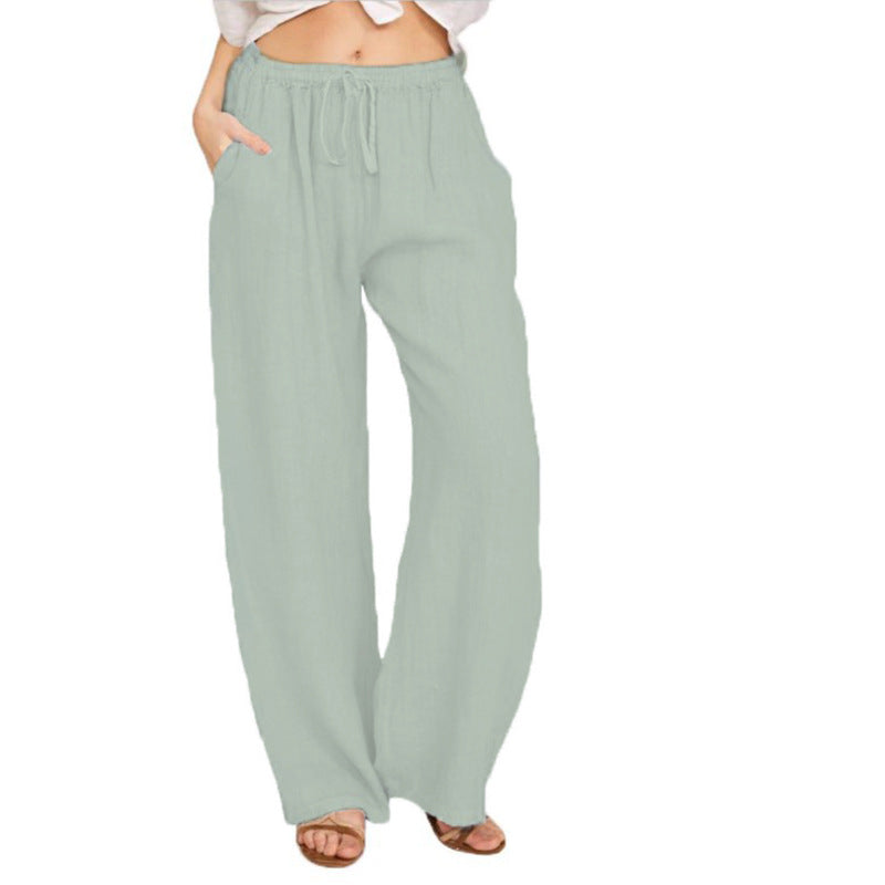 Women's airy palazzo pants with drawstring waistband, elastic waist finish, and side pockets Mune Fashion