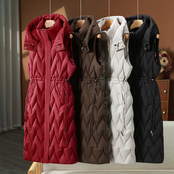 Women's longer sleeveless quilted coat with hood, tailored drawstring and organic wave quilting Mune Fashion