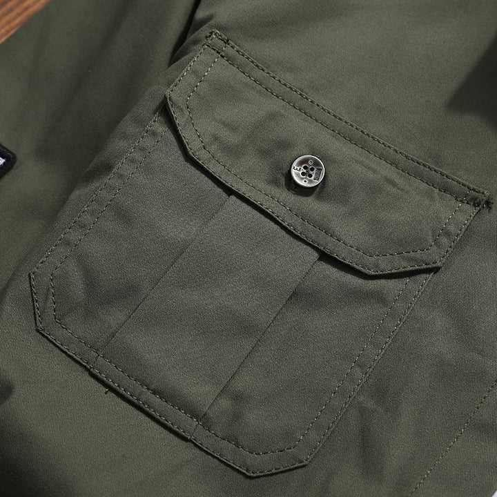 Men's utility shirt jacket with chest pockets, shoulder epaulettes, and badge applications Mune Fashion