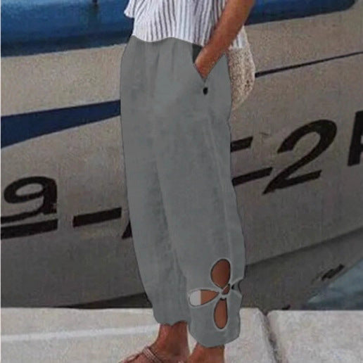 Women's light summer pants with elastic waistband, gathered ankle, and flower-shaped cutout Mune Fashion
