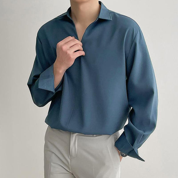 Women's loosely cut tunic blouse with deep V-neck, concealed button placket, and dropped shoulders Mune Fashion