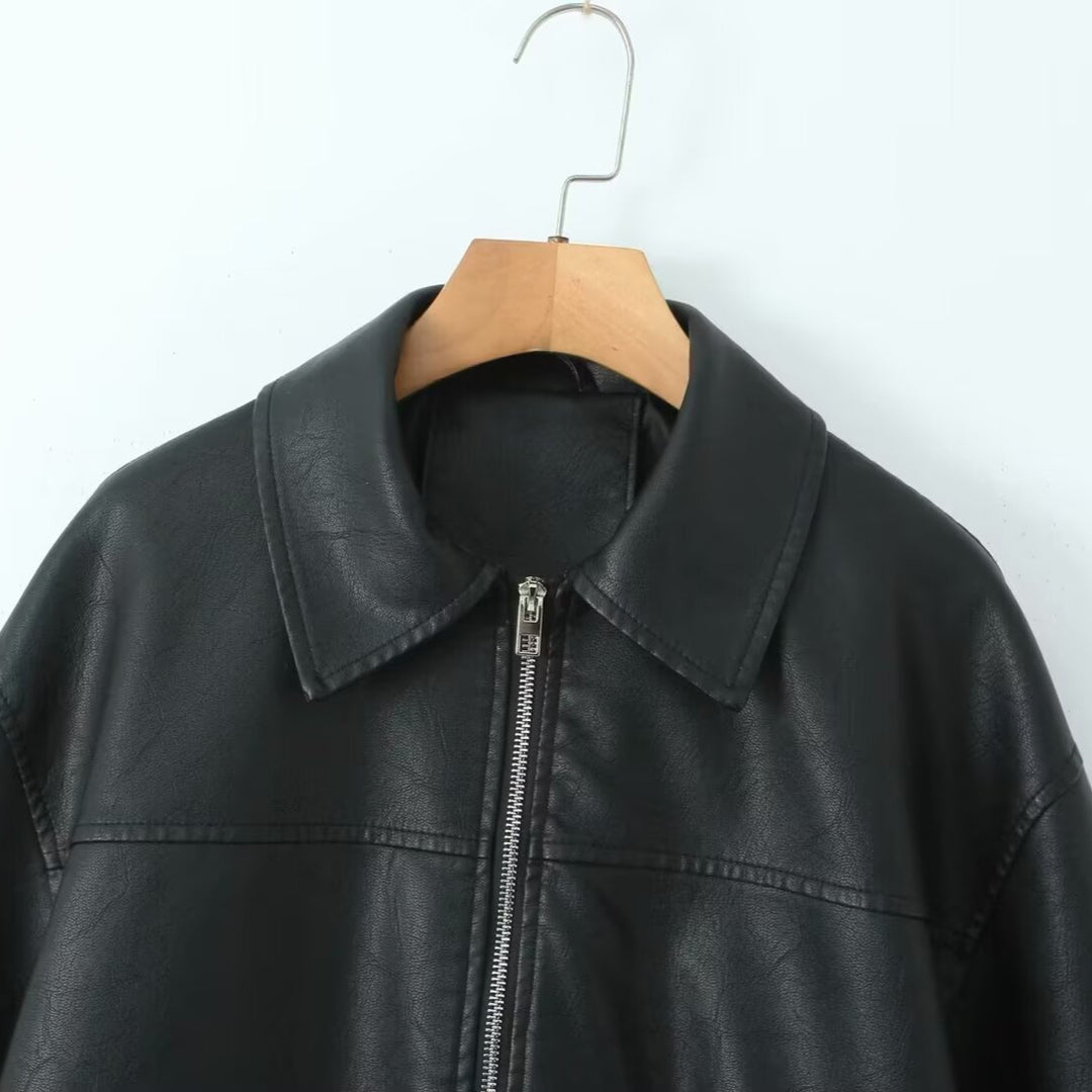 Women's oversized faux leather bomber jacket with shirt collar, elastic hem, and patch pockets Mune Fashion