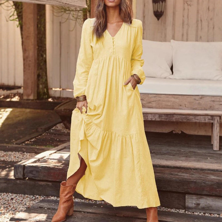 Women's airy maxi dress with V-neck, long sleeves, and side pockets Mune Fashion