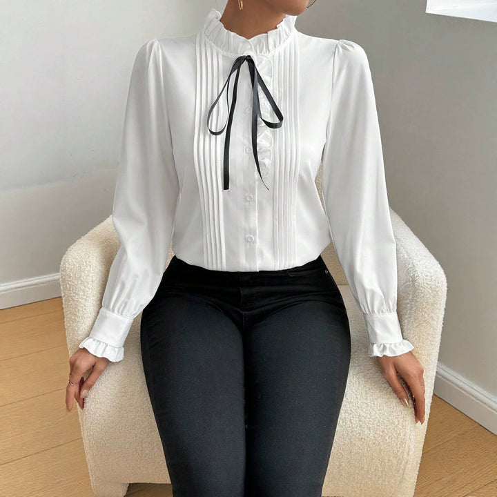 Women's ruffle blouse with stand-up collar, vertical pleats and ribbon tie Drune