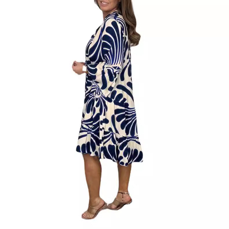 Women's tiered dress with large leaf print, V-neck and three-quarter sleeves Mune Fashion