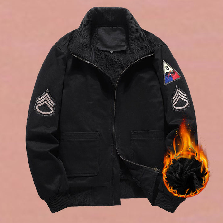 Men's military-inspired bomber jacket with applied patches, concealed zipper, and elastic cuffs.