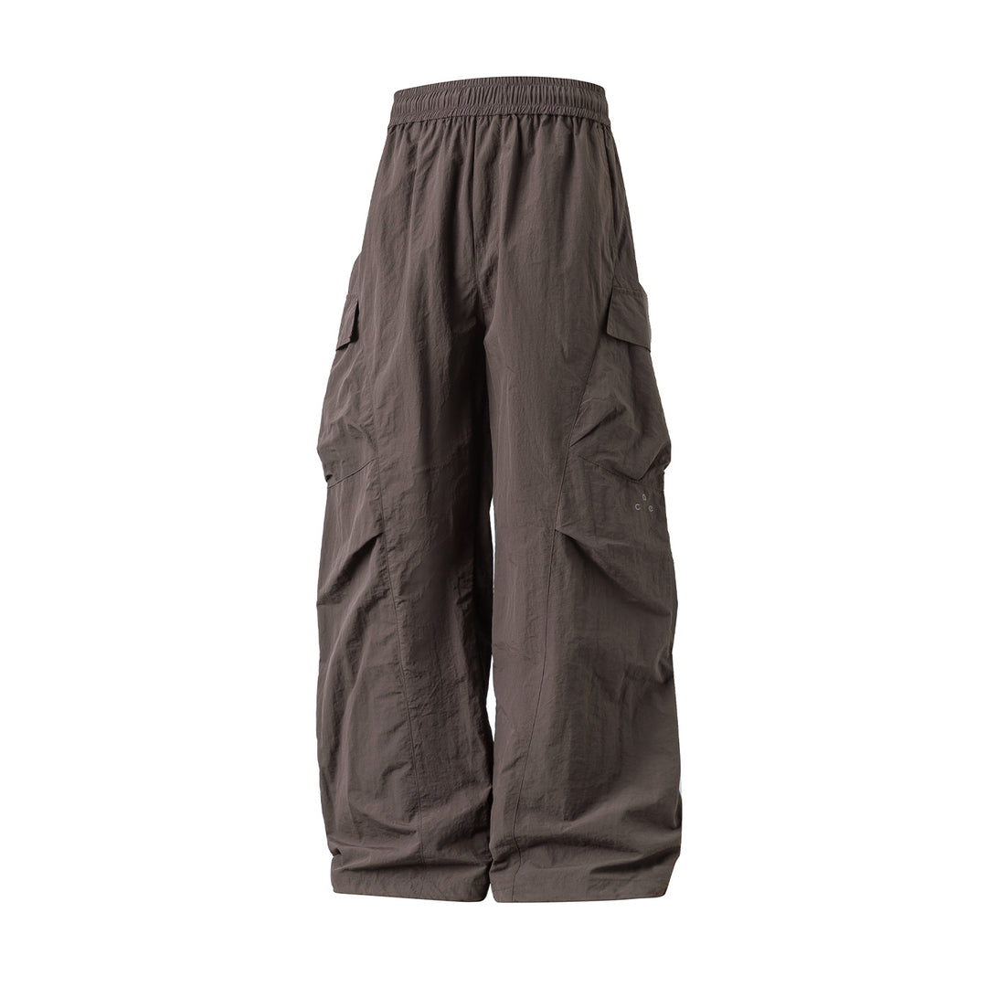 Unisex Wide Cargo Palazzo Pants made of technical crinkle nylon with elastic waistband Mune Fashion
